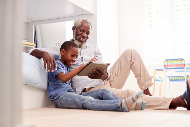 grandpa and grandson using tablet together