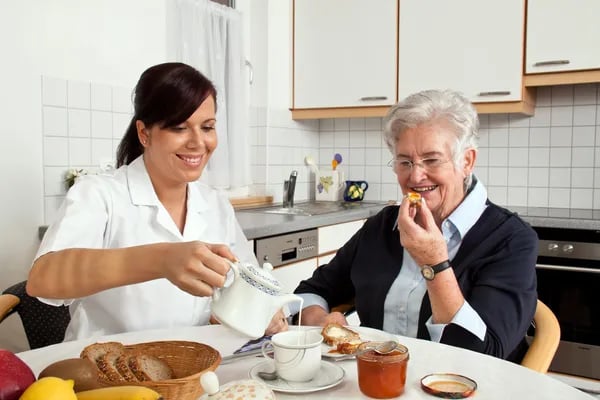 depositphotos_11861376-stock-photo-nurse-helps-elderly-woman-at