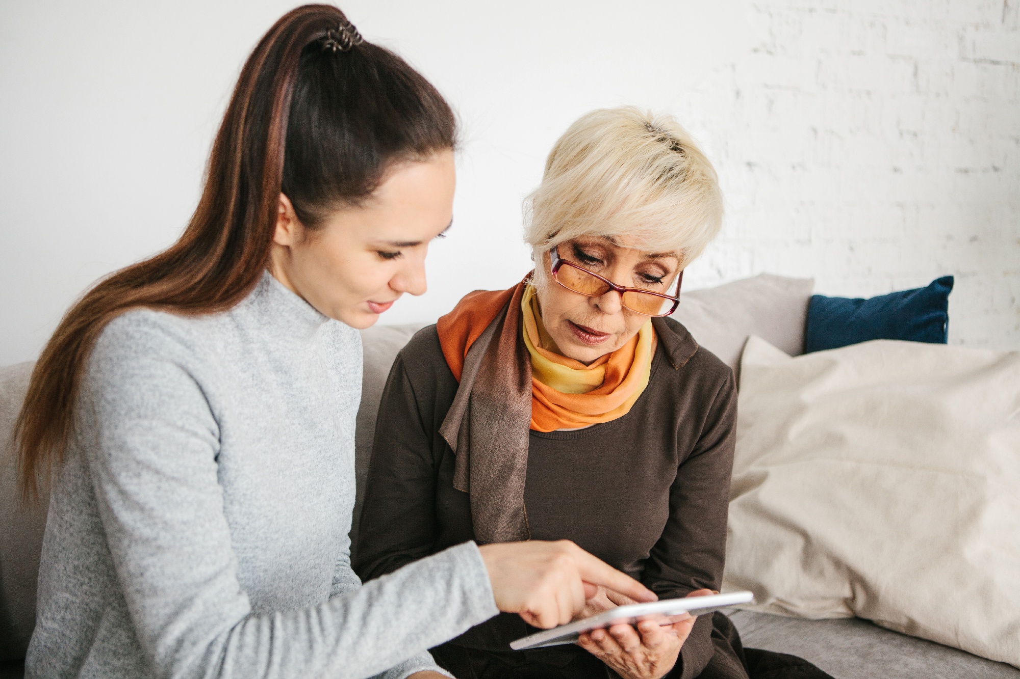 teaching grandmother to use a tablet