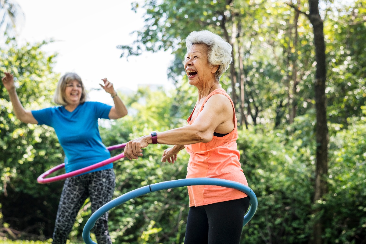 senior women exercising in park