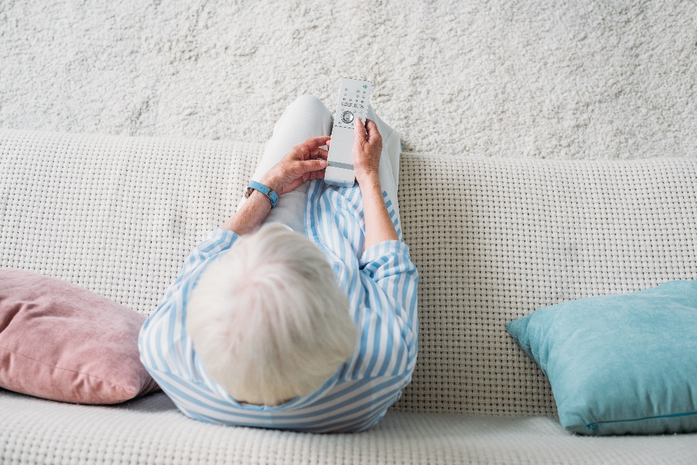older woman watching tv