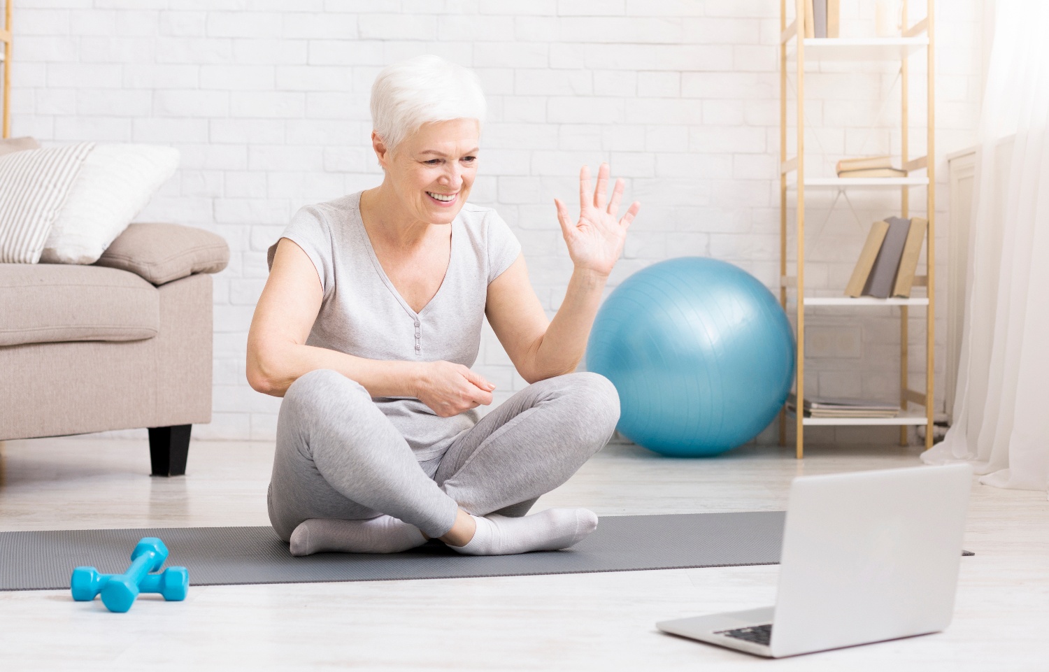 senior woman exercises online