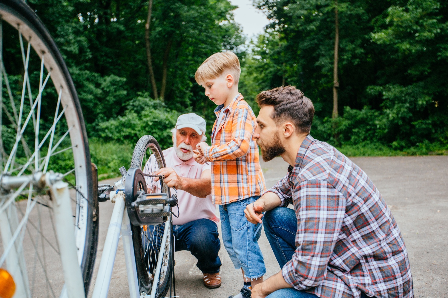 family working on bicycle together