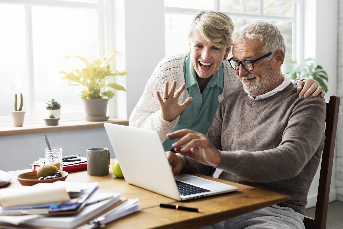 older adult couple using computer