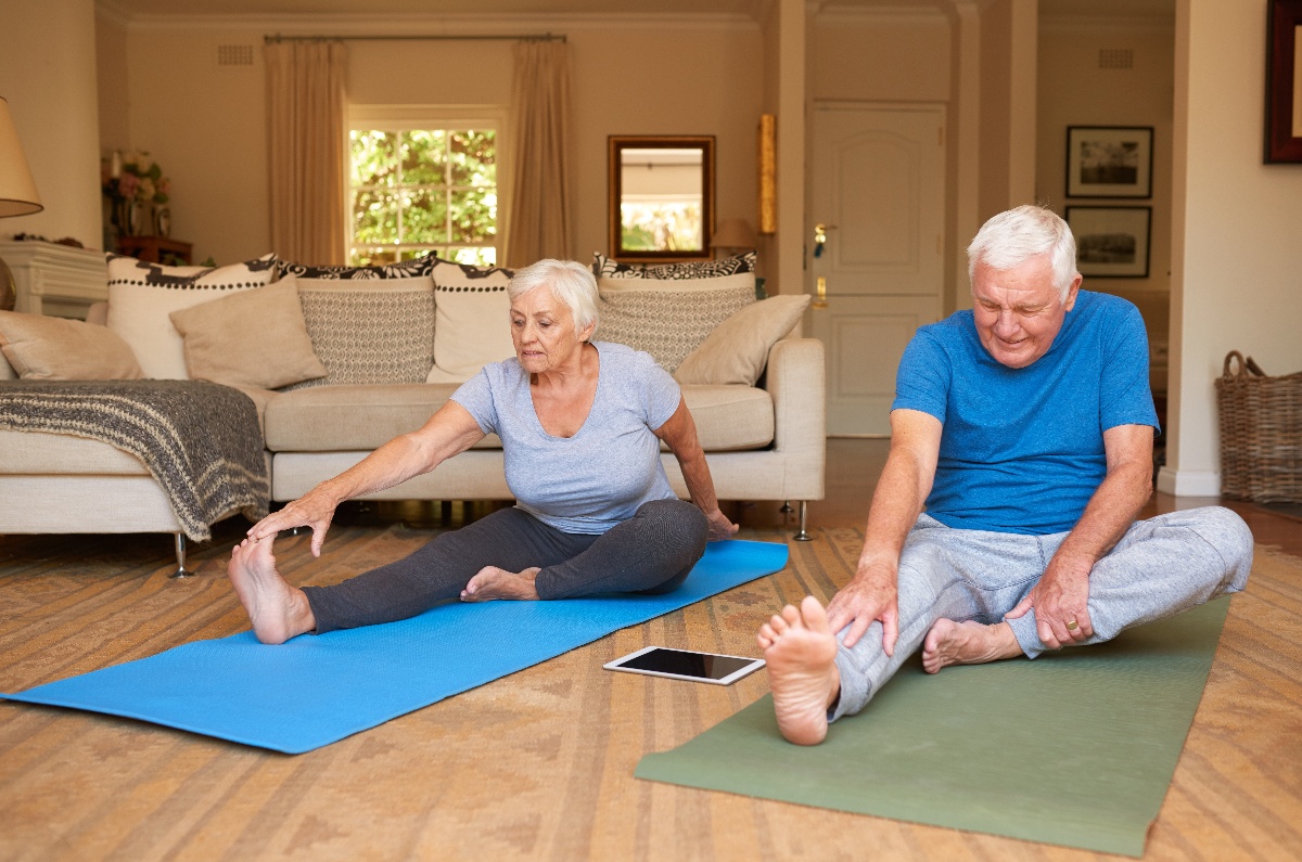 senior couple exercising at home