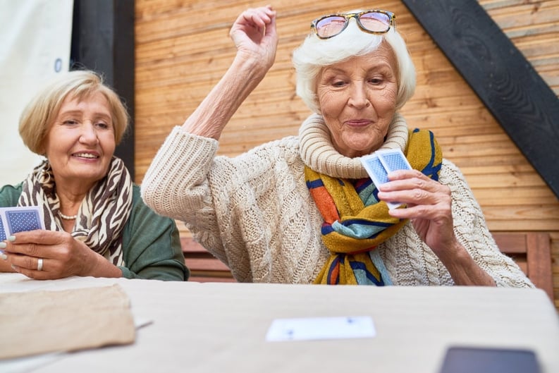 senior women playing card games