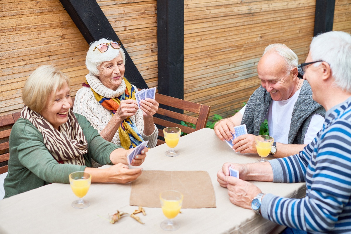 group of seniors playing cards together